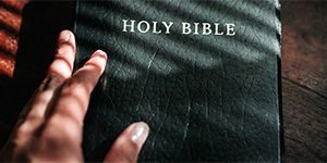 hand-on-bible-01_header_col