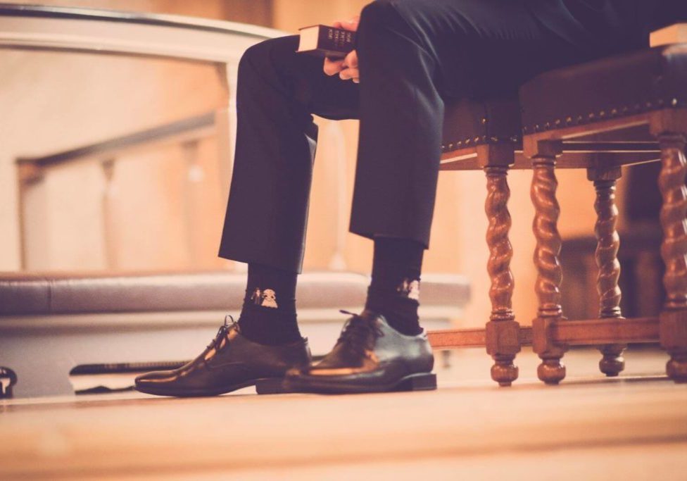 person-sitting-on-a-chair-holding-book-636010